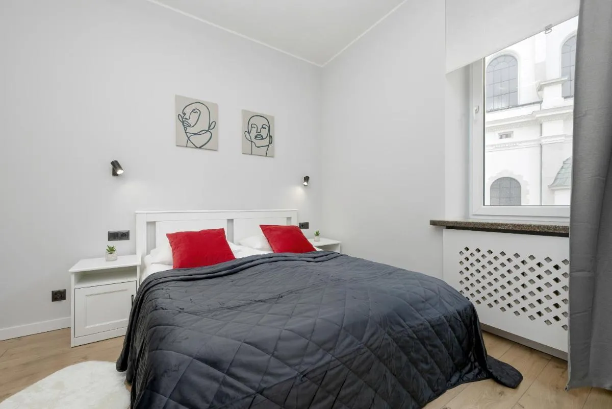 Image 1 of Exclusive Grey and Red Apartment in Warsaw Center by Noclegi Renters