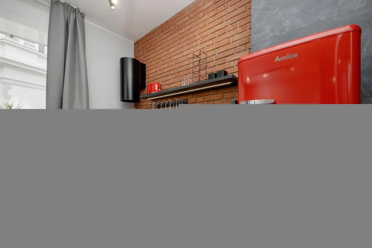 Image 2 of Exclusive Grey and Red Apartment in Warsaw Center by Noclegi Renters