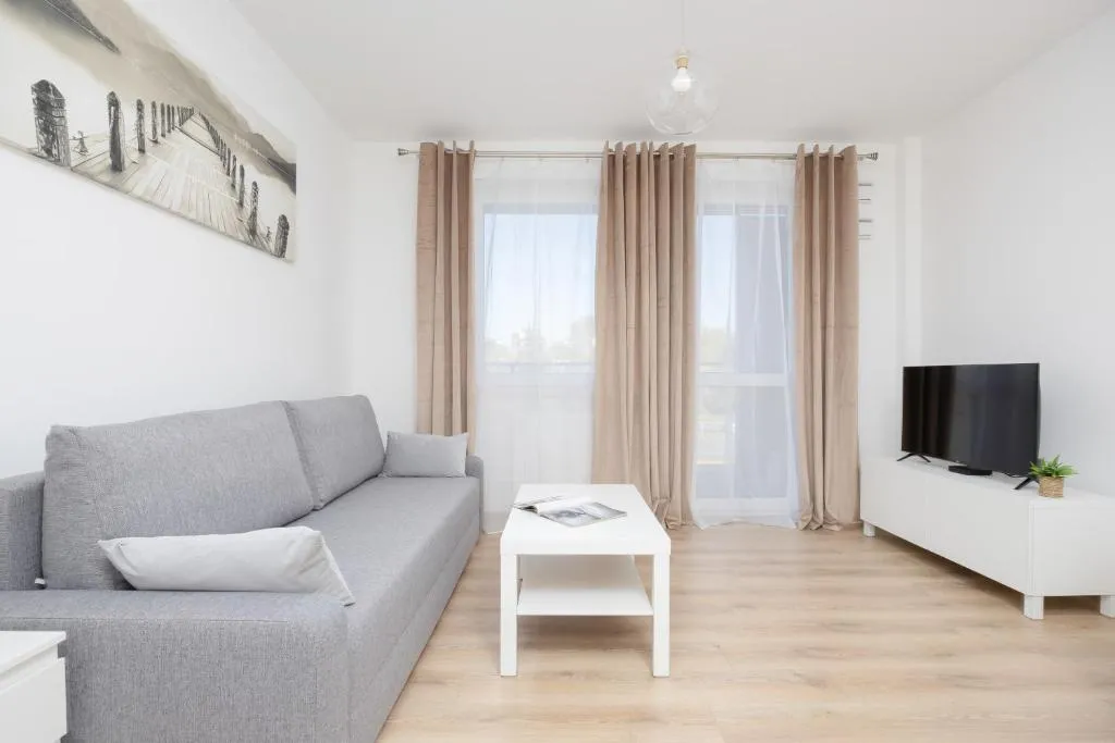 Image of Air Conditioned Apartment in Warsaw with Parking, Desk and Balcony by Noclegi Renters