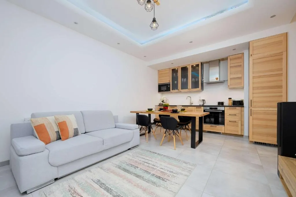 Image of Bright Apartment with Parking and Remote Work in Warsaw Wola by Noclegi Renters