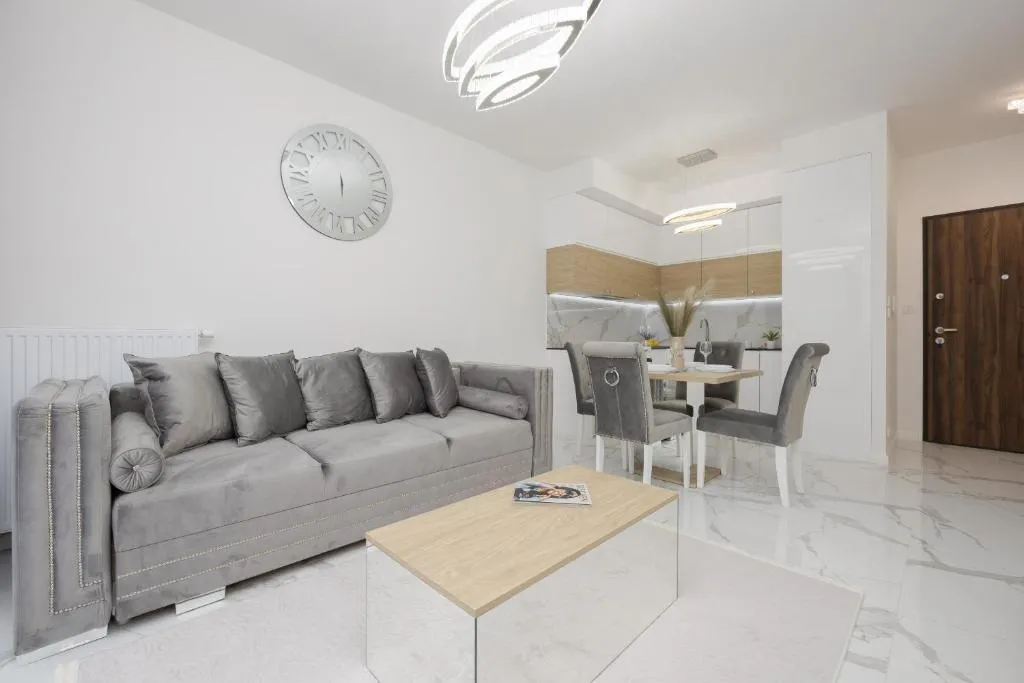 Image of Luxurious Grey Apartment with Sauna, Gym and Parking by Noclegi Renters