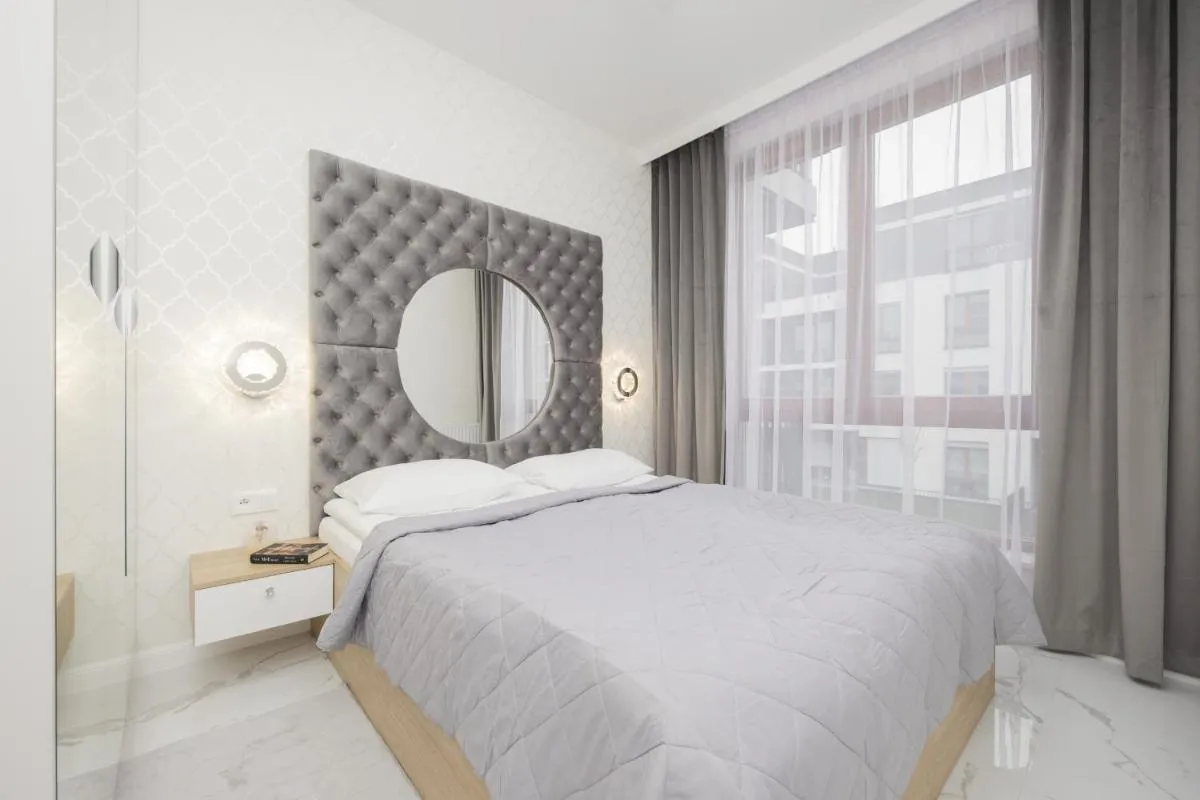 Image 1 of Luxurious Grey Apartment with Sauna, Gym and Parking by Noclegi Renters