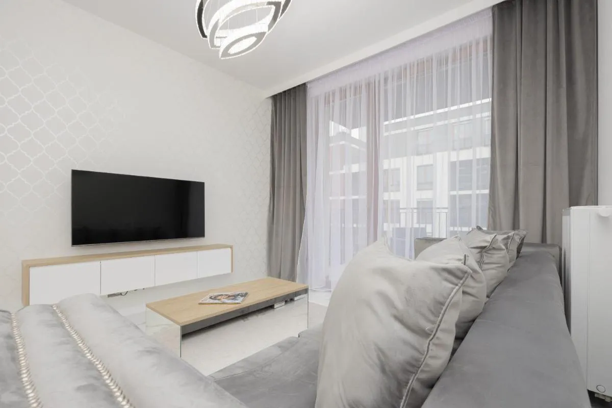 Image 3 of Luxurious Grey Apartment with Sauna, Gym and Parking by Noclegi Renters