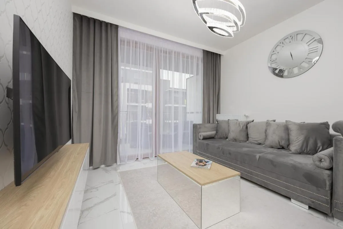 Image 4 of Luxurious Grey Apartment with Sauna, Gym and Parking by Noclegi Renters